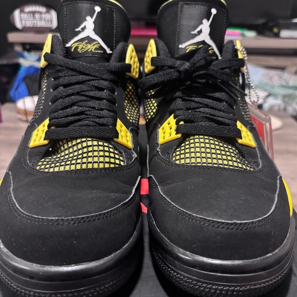 black and yellow jordans 10